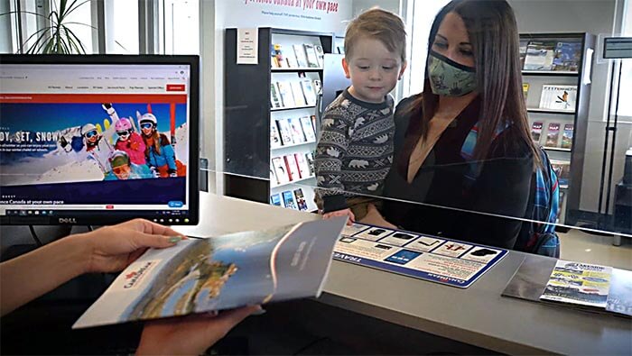 Mother and child enquiring about renting an RV