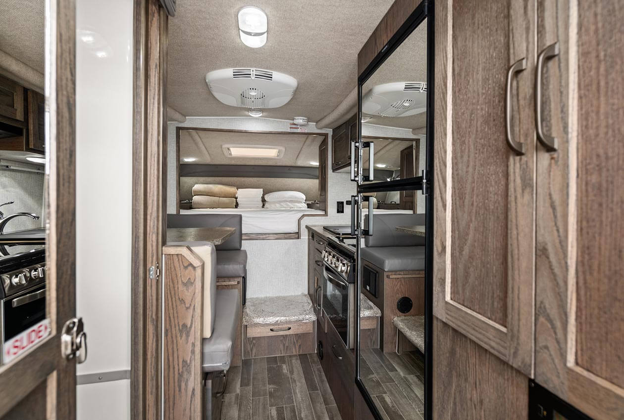 Dinette, kitchen and queen overcab bed in 澳洲幸运5开奖结果体彩网 CanaDream truck and camper