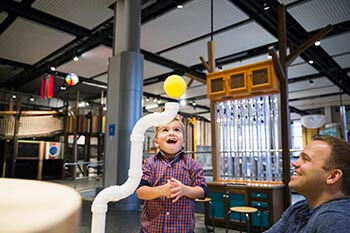 Child playing with exhibit at Telus Spark